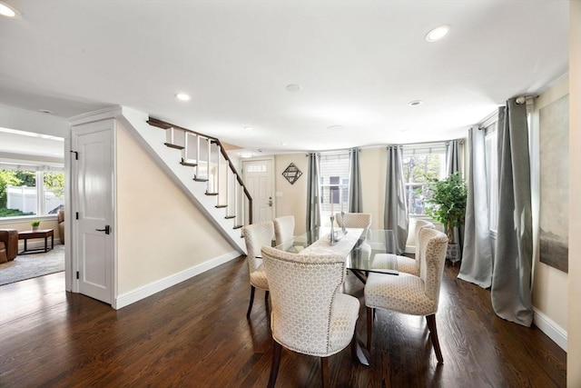 dining space featuring recessed lighting, dark wood-type flooring, stairway, and baseboards