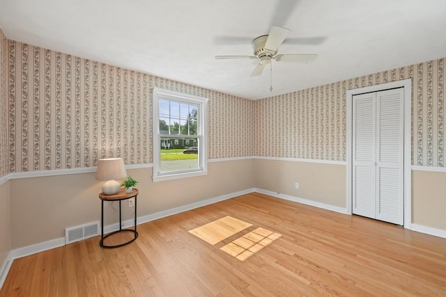 45 Donamor Ln, East Longmeadow, MA 01028 - unfurnished bedroom with wood finished floors, wallpapered walls, baseboards, and ceiling fan
