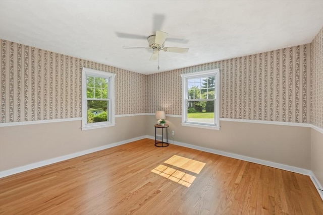 45 Donamor Ln, East Longmeadow, MA 01028 - spare room with wallpapered walls, baseboards, wood finished floors, plenty of natural light, and ceiling fan