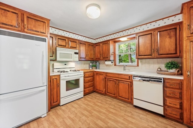 45 Donamor Ln, East Longmeadow, MA 01028 - kitchen featuring white appliances, light countertops, and brown cabinets