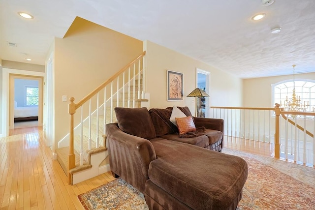 living area with recessed lighting, plenty of natural light, and light wood-style flooring