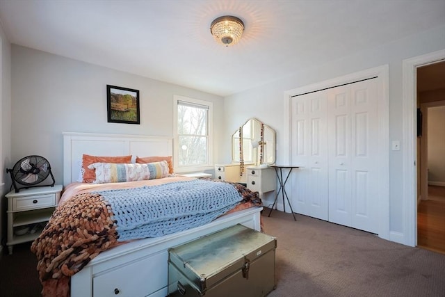 bedroom featuring dark carpet and a closet