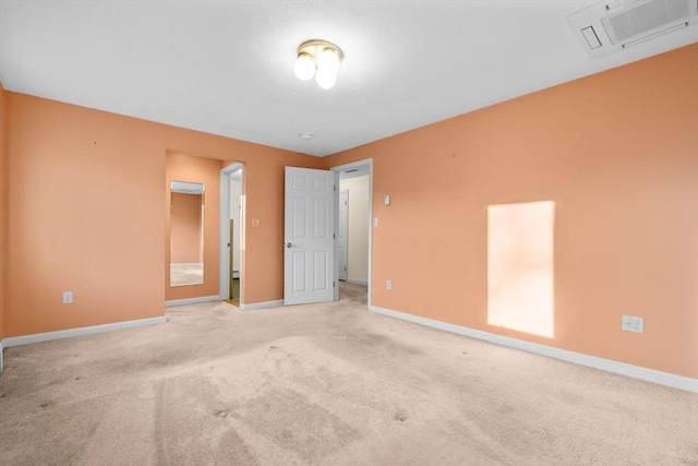 spare room with light carpet