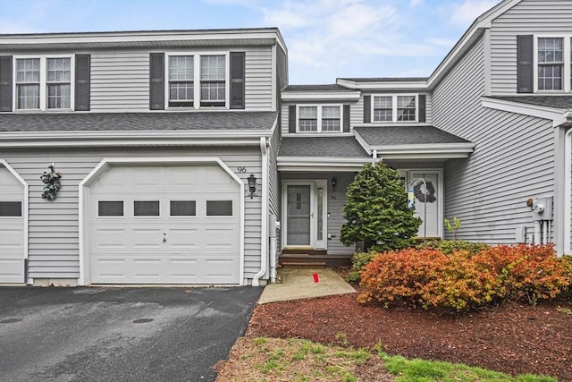 96 Caspian Way Unit 96, Fitchburg, MA 01420 - view of front of home with asphalt driveway, an attached garage, and roof with shingles