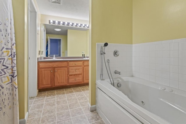96 Caspian Way Unit 96, Fitchburg, MA 01420 - full bath with a tub with jets, double vanity, and baseboards
