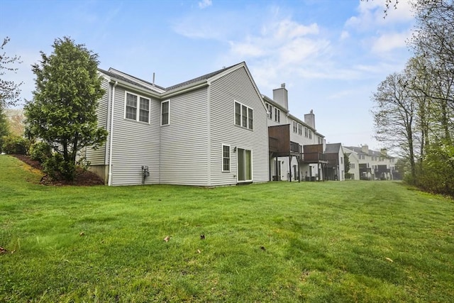 96 Caspian Way Unit 96, Fitchburg, MA 01420 - back of house featuring a chimney and a yard