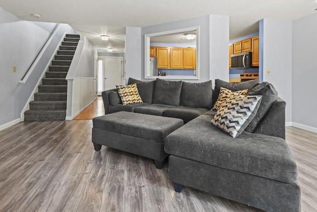 96 Caspian Way Unit 96, Fitchburg, MA 01420 - living area with stairs, baseboards, and wood finished floors