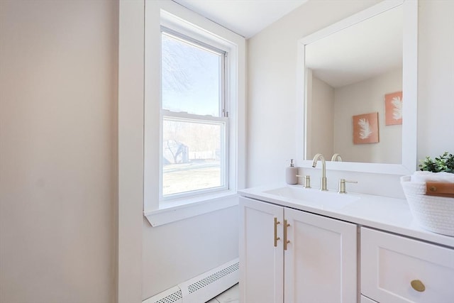 bathroom with vanity and a baseboard heating unit