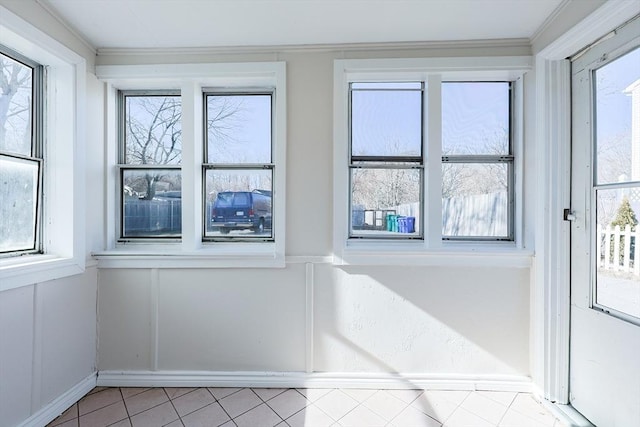 doorway to outside featuring light tile patterned floors