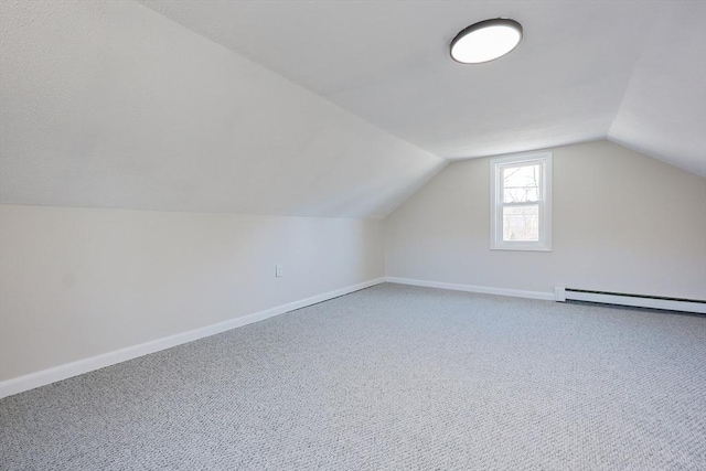 bonus room featuring carpet floors, lofted ceiling, and a baseboard heating unit