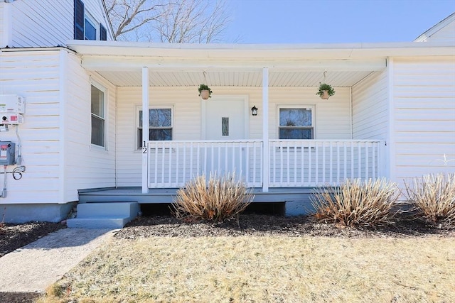 property entrance featuring a porch