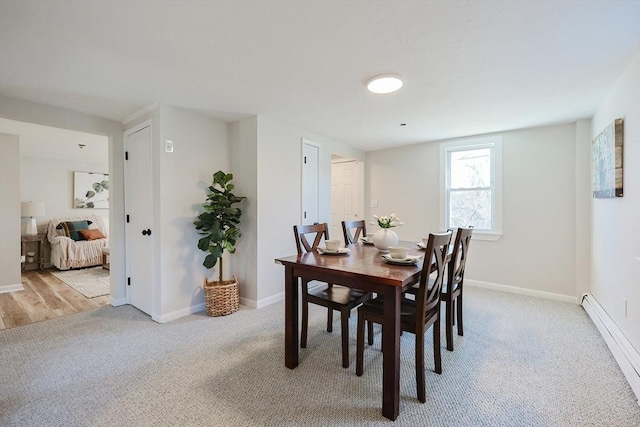 dining area featuring light colored carpet