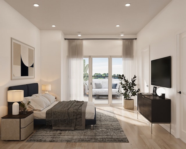 bedroom featuring light hardwood / wood-style floors and access to exterior