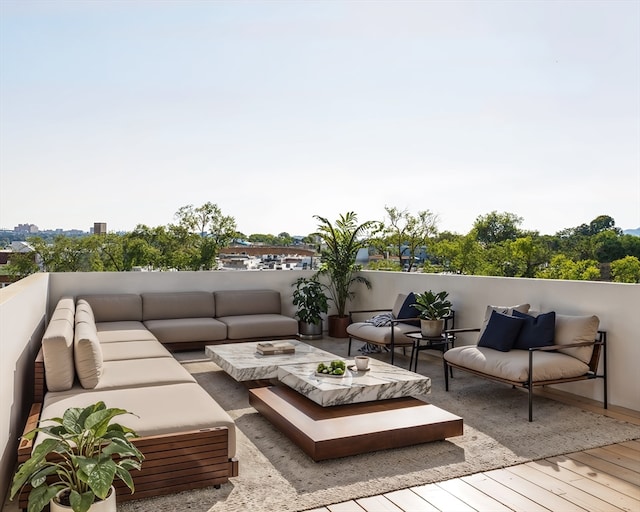 wooden deck with an outdoor living space