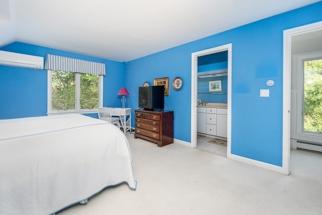 bedroom with light carpet, ensuite bath, multiple windows, and a wall mounted AC