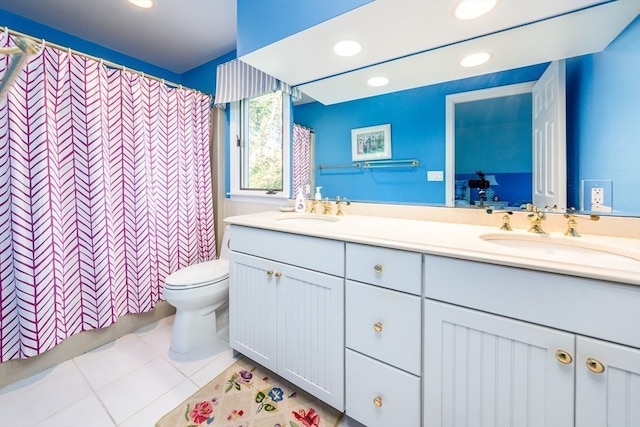 bathroom with vanity, tile patterned flooring, toilet, and curtained shower