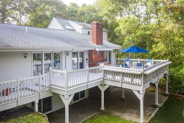 rear view of property with a deck