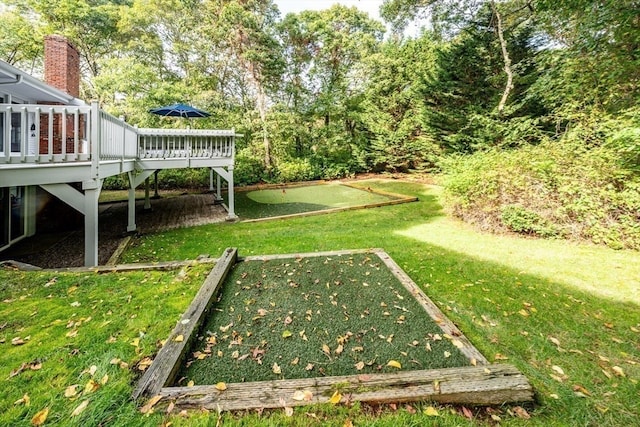 view of yard with a wooden deck