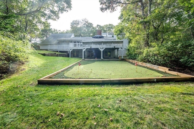 view of property's community with a yard