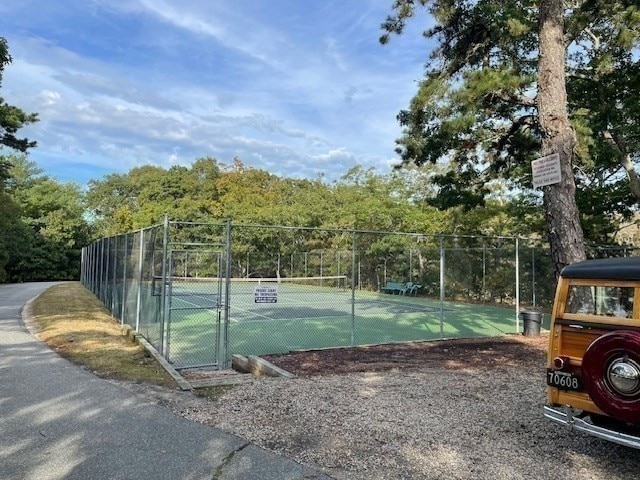 view of sport court featuring tennis court