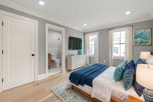 bedroom with light wood-style floors, recessed lighting, crown molding, and ensuite bath