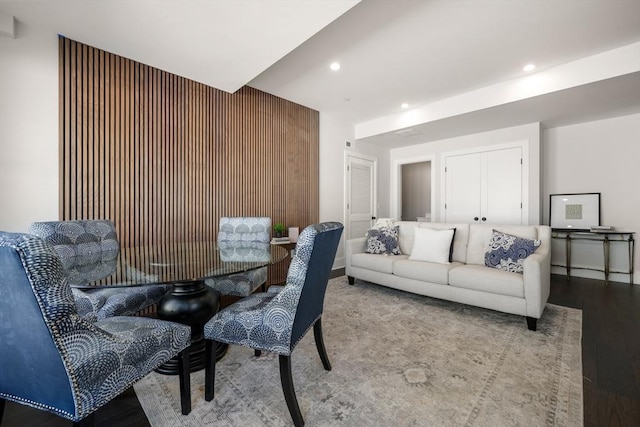 dining space featuring wood finished floors and recessed lighting