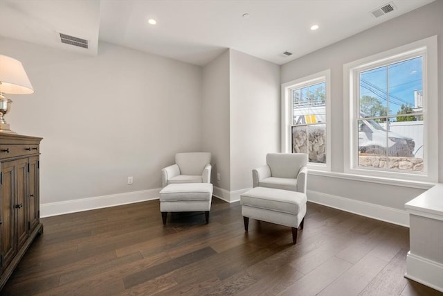 living area with dark wood-style floors, baseboards, and recessed lighting