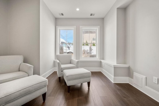 living area with dark wood-style floors, baseboards, and recessed lighting