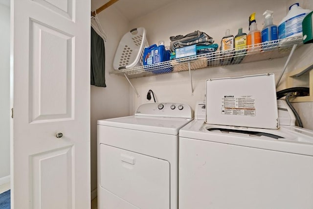 washroom featuring laundry area and independent washer and dryer