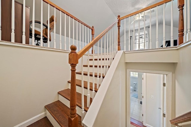 stairs featuring baseboards