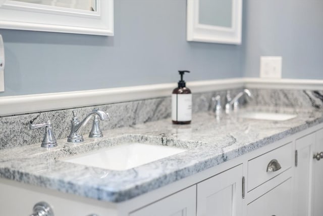 bathroom featuring double vanity and a sink