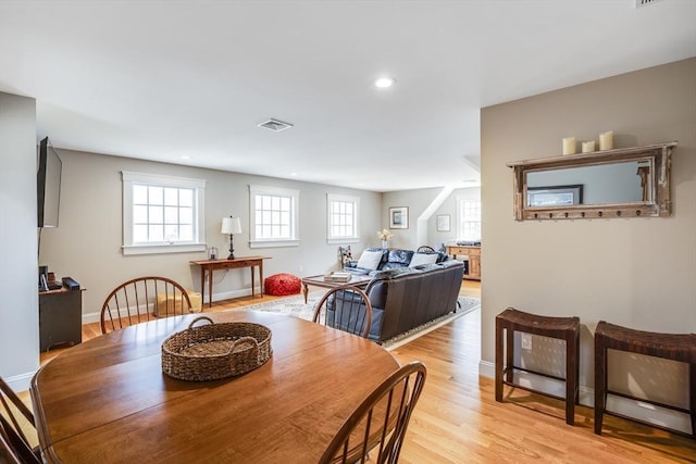 dining room with baseboards, recessed lighting, light wood-style floors, and visible vents