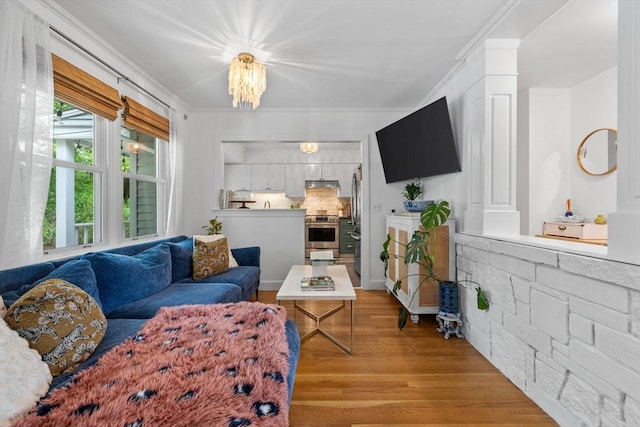 2313 Washington St, Holliston, MA 01746 - living area featuring light wood finished floors and ornamental molding