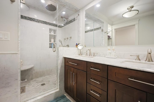 bathroom featuring crown molding, vanity, and an enclosed shower