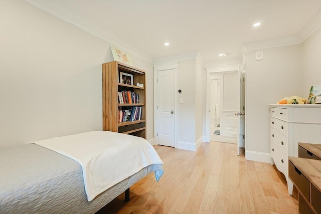 bedroom featuring light hardwood / wood-style flooring and ornamental molding