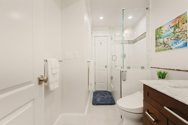 bathroom with tile patterned floors, ornamental molding, vanity, a shower with door, and toilet