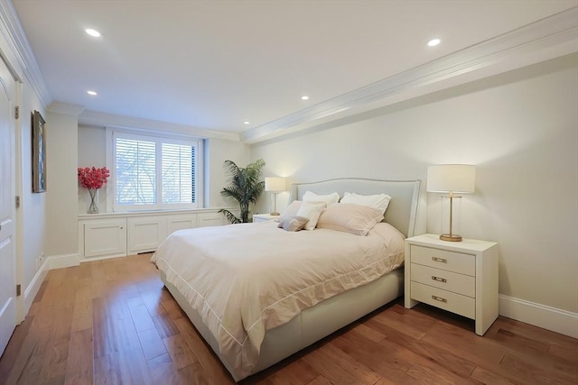 bedroom featuring hardwood / wood-style floors and ornamental molding