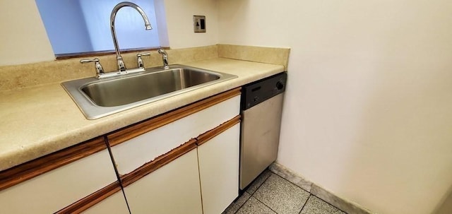 133 Commander Shea Blvd Unit 315, Quincy, MA 02171 - kitchen with a sink, stainless steel dishwasher, white cabinets, light countertops, and baseboards