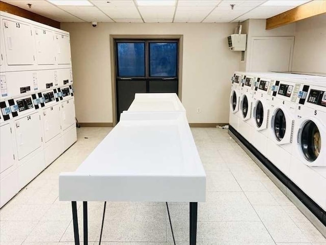 133 Commander Shea Blvd Unit 315, Quincy, MA 02171 - community laundry room featuring stacked washer / dryer, washing machine and dryer, and baseboards