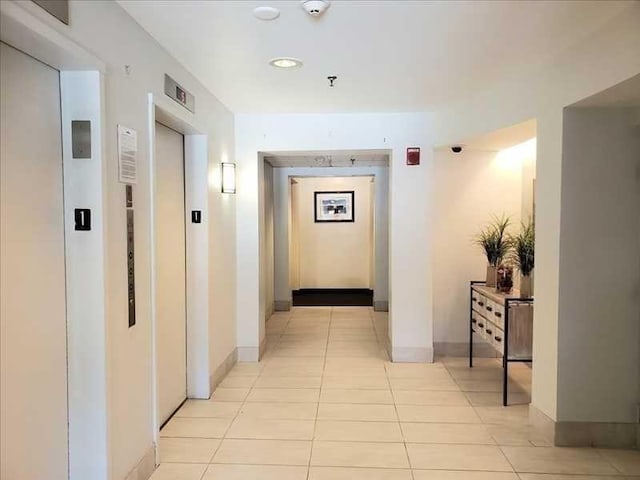 133 Commander Shea Blvd Unit 315, Quincy, MA 02171 - corridor featuring elevator, light tile patterned floors, baseboards, and recessed lighting