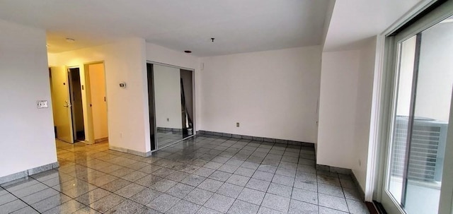 133 Commander Shea Blvd Unit 315, Quincy, MA 02171 - unfurnished room featuring healthy amount of natural light and baseboards