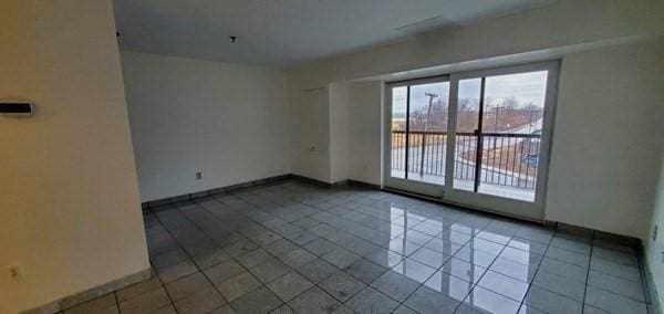 133 Commander Shea Blvd Unit 315, Quincy, MA 02171 - empty room featuring tile patterned floors and baseboards