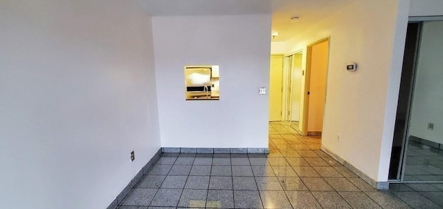 133 Commander Shea Blvd Unit 315, Quincy, MA 02171 - tiled empty room featuring baseboards