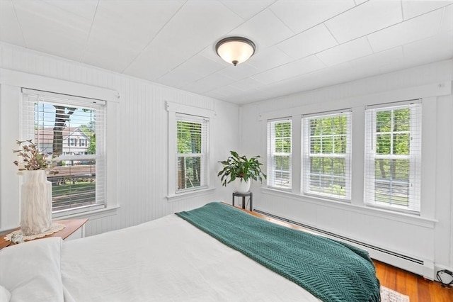 8 Intervale Rd, Rutland, MA 01543 - bedroom with multiple windows, a baseboard heating unit, and wood finished floors