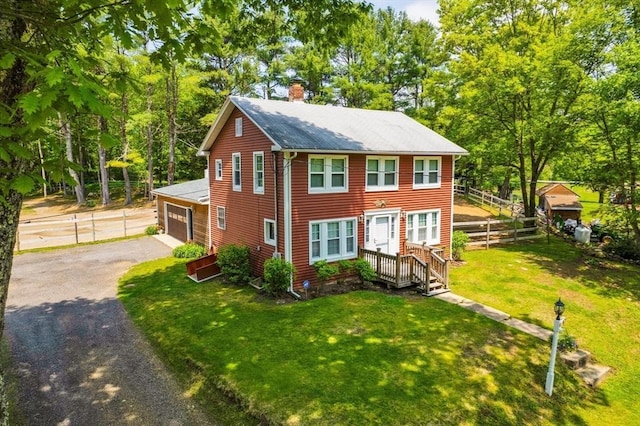 8 Intervale Rd, Rutland, MA 01543 - view of front of home with driveway, a chimney, and view of wooded area