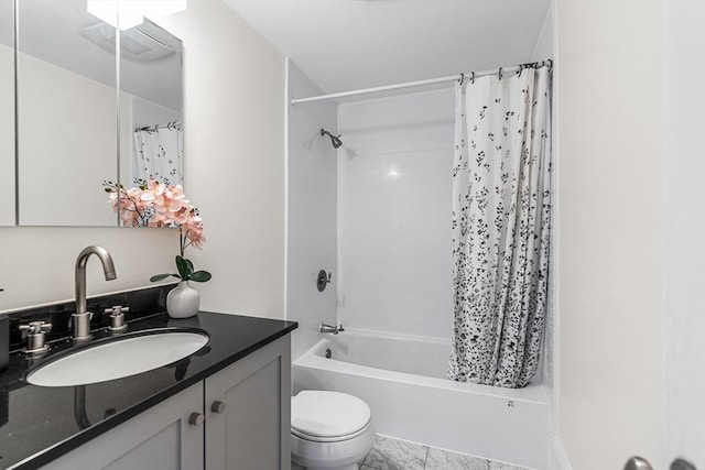 bathroom featuring vanity, toilet, and shower / bathtub combination with curtain