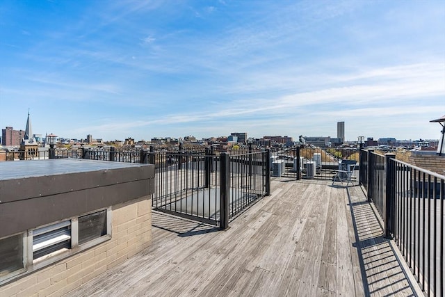 wooden terrace with a view of city