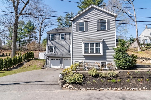 view of front of home featuring a garage and driveway