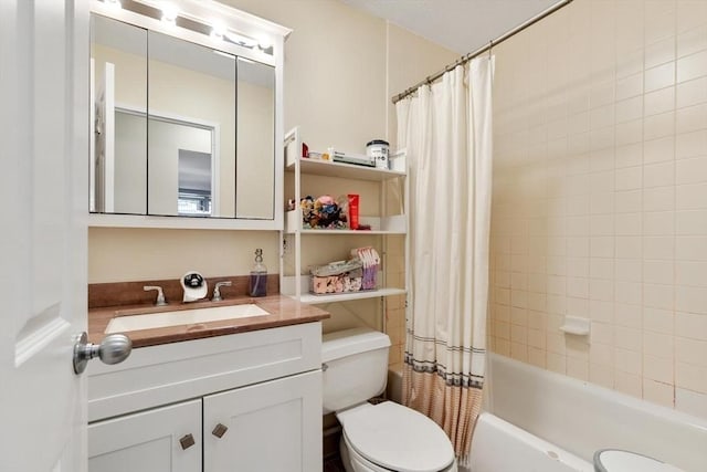 full bathroom featuring vanity, shower / bathtub combination with curtain, and toilet