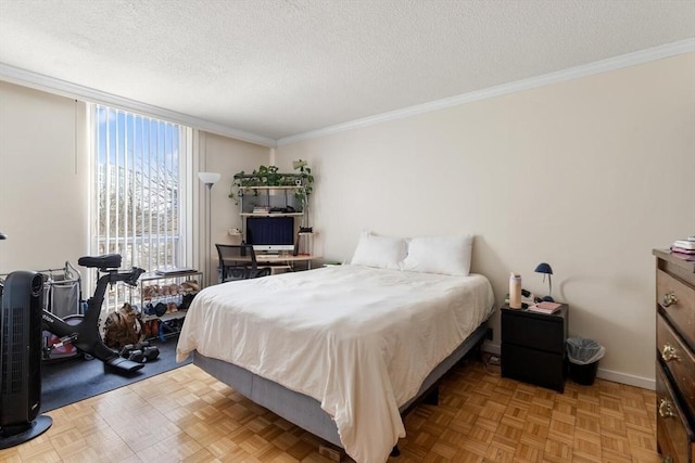 bedroom with ornamental molding, a textured ceiling, and light parquet floors